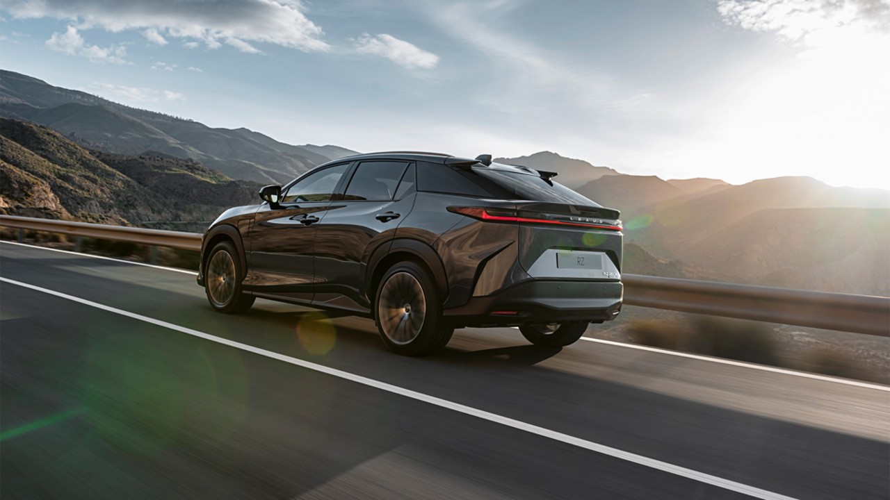 A Lexus RZ 450e driving in a mountainous location