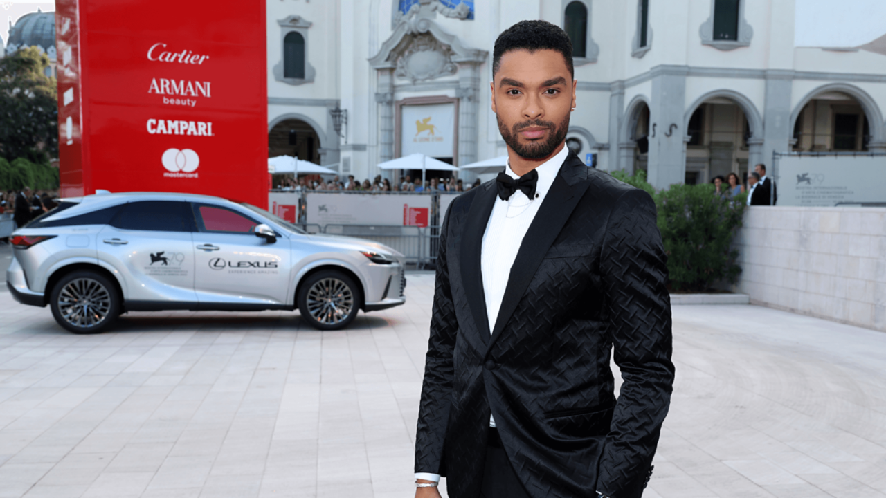 Regé-Jean Page stood in front a Lexus RX at the Venice Film Festival